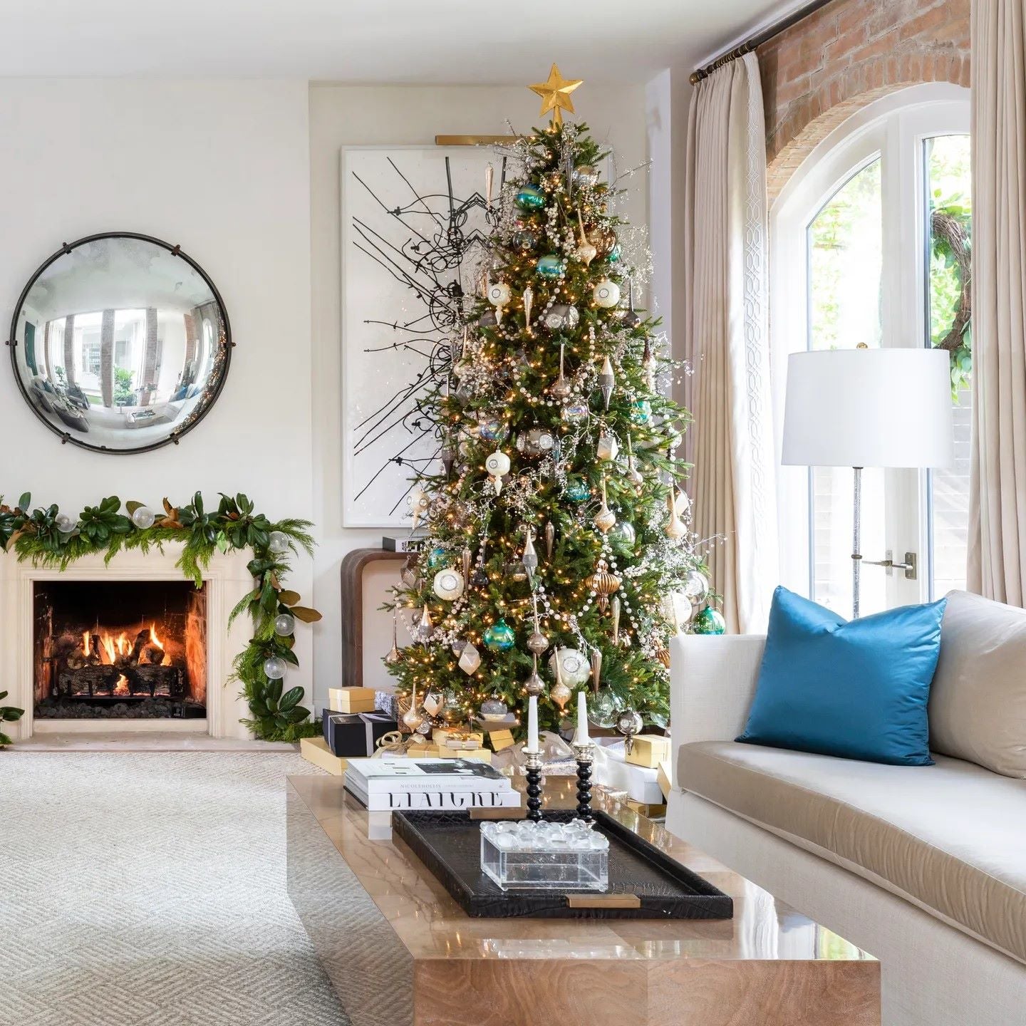 American modern living room decorated for winter with Christmas tree and fireplace representing indoor air conditions that can affect winter allergies.