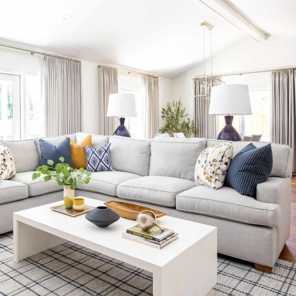 Modern American living room with new sectional sofa and furniture illustrating VOC off gassing and indoor air quality concerns.