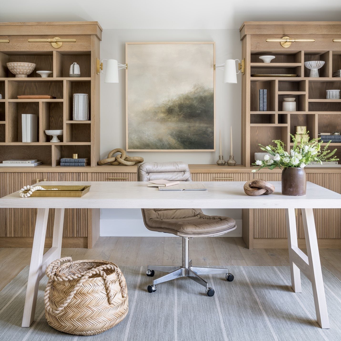 Modern American home office with built-in wood shelving and desk workspace illustrating furniture materials that may release VOCs into indoor air.